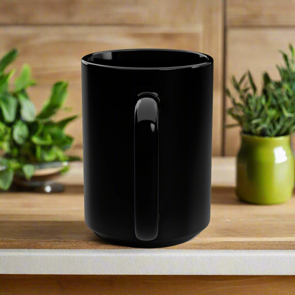 Black mug with a handle on a white background
