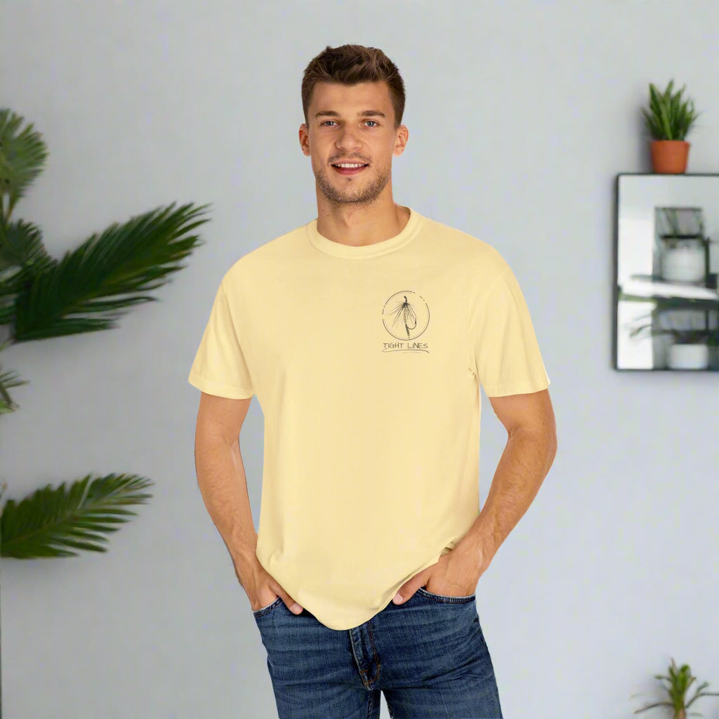 Man wearing a light yellow t-shirt with a logo on a white background
