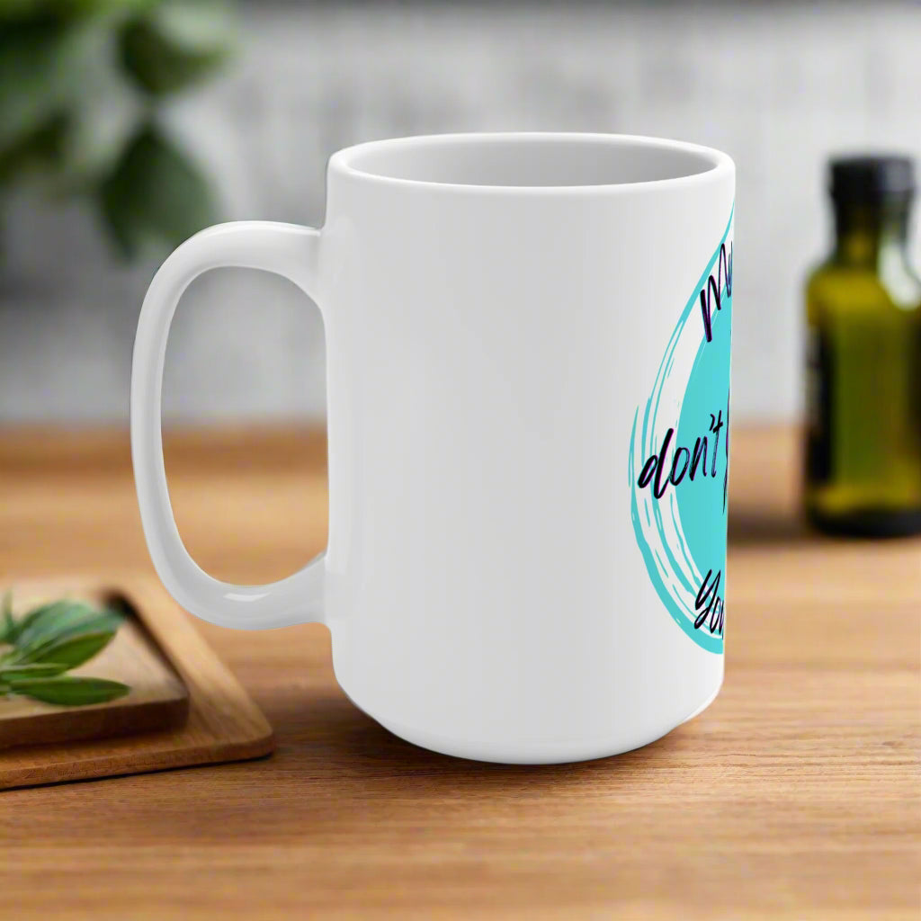 White mug with a blue and black design on a white background