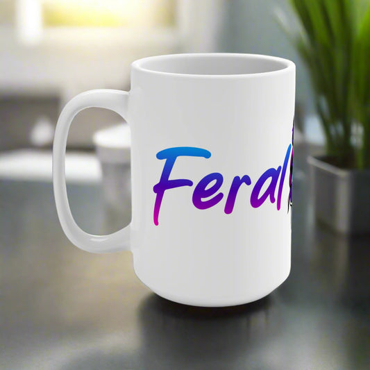 White mug with colorful 'Feral' text on a white background