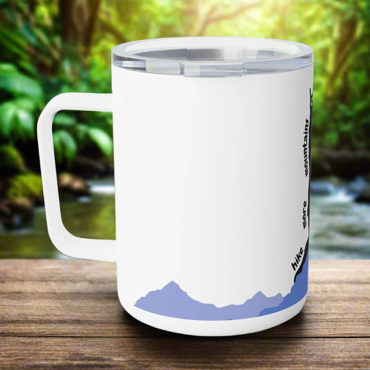 White mug with mountain design and text on a white background