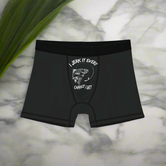 Black boxer briefs with graphic design and text on a white background