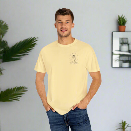 Man wearing a light yellow t-shirt with a logo on a white background