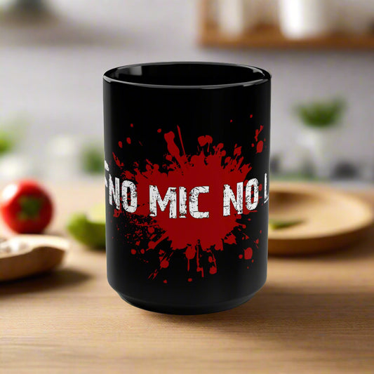 Black mug with red splatter design and 'NO MIC NO' text on a white background