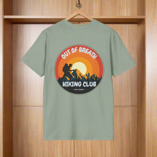 Green t-shirt with 'Out of Breath Hiking Club' graphic on a white background