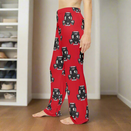 Red pajama pants with black graphic design on a white background
